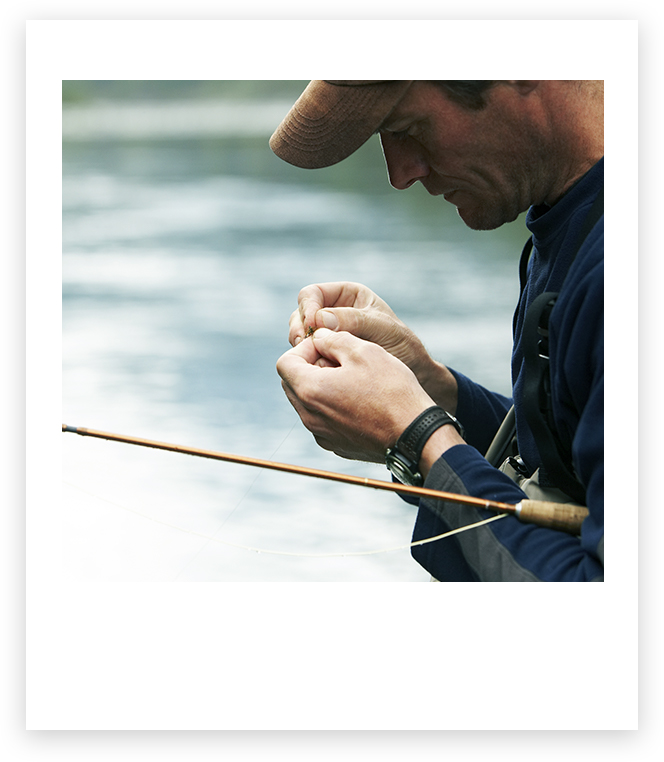 Man putting bait on a fishing line